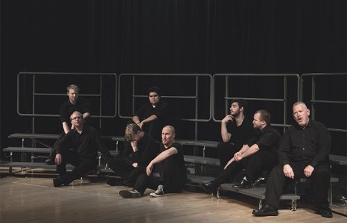 Group of male vocalists performing