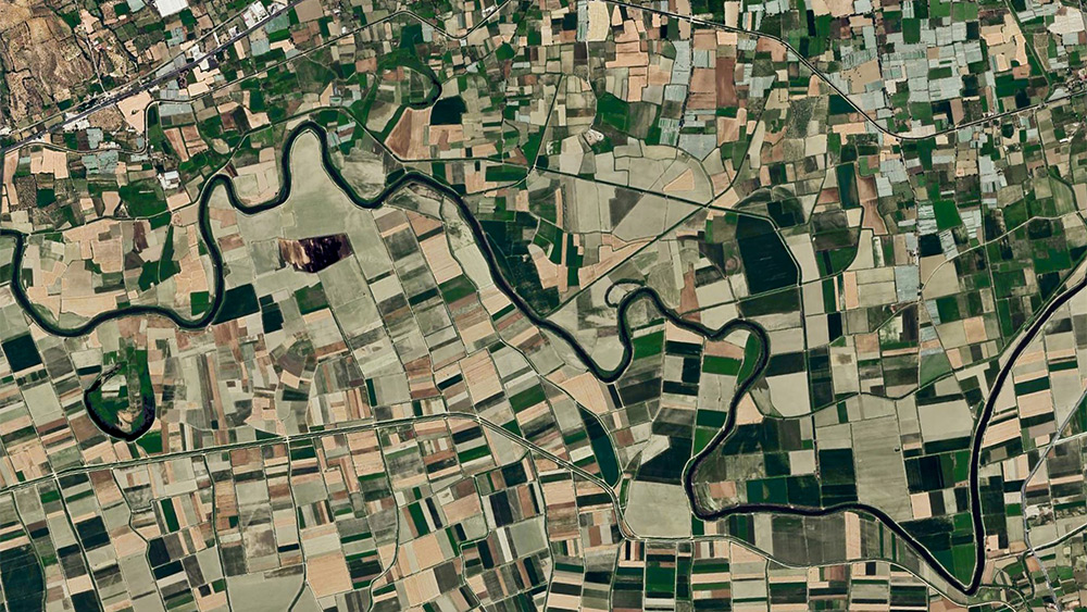 Aerial photograph of a river winding through farmland